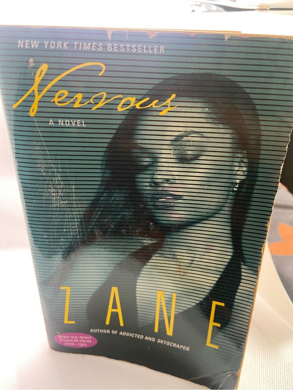 Nervous by Zane — Teal & Yellow Paperback Novel